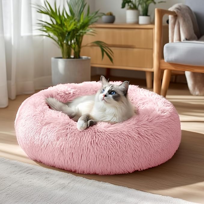 Deconovo Calming Donut Dog Bed, Washable Plush Round Pet Bed for Small Dogs & Cats with Raised Rim, Non-Slip Base and Soft Faux Fur—Lightweight, Easy-Care Design Pink 25" L x 25" W x 8" Th